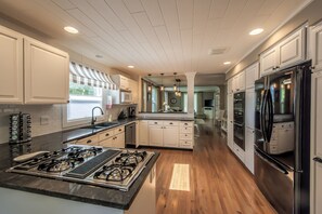 Coffee/tea maker, high chair, cookware/dishes/utensils, ice maker