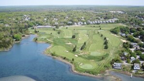 An aerial view of a golf course with a lake, surrounded by residential areas. - Stunning Sunsets on Quonnie Waterfront- 2 Kayaks, Beach Pass & Backyard Clamming (Charlestown)