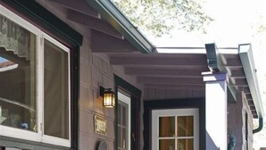 A house with a front door, a small porch, and steps leading to the door. - Fabulous Downtown Living (Santa Barbara)