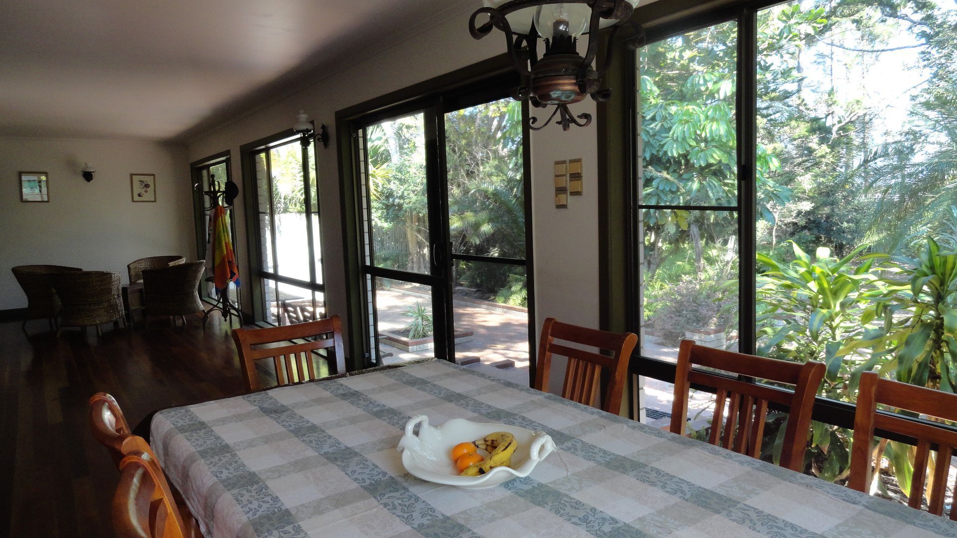 Sun room adjacent to dining room area.