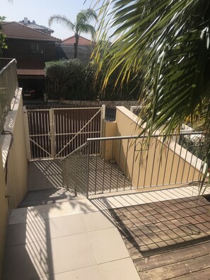 Enter a secure, community with a beautifully landscaped garden and paved pathway.