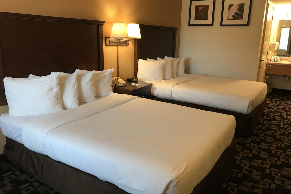 standard room, 2 queen beds, non smoking | blackout curtains, iron/ironing board, rollaway beds, free wifi