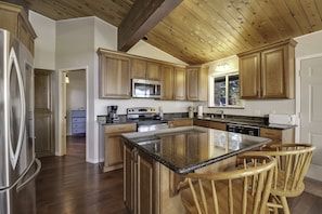 Gourmet kitchen with prep island, tons of cabinet and counter space.