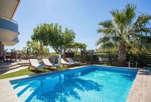 A heated pool, pool loungers