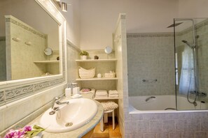 Combined shower/tub, hair dryer, towels, toilet paper