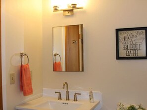 Bathtub, hair dryer, towels