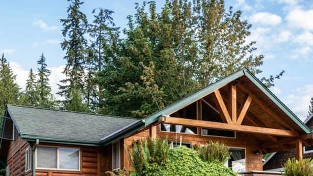 A log cabin with a stone fire pit in front. - ~ Lakeside Log Cabin ~ Blessings & Memories Abound! (Graham)