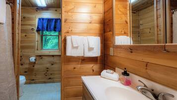 Combined shower/bathtub, hair dryer, towels, soap