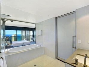 Bathtub, jetted bath, hair dryer, towels