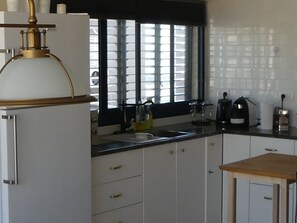 Fridge, microwave, cookware/dishes/utensils