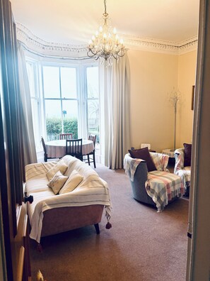 Smart TV, fireplace, books, printers