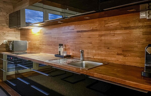 Fridge, stovetop, dishwasher, coffee/tea maker