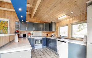 Fridge, stovetop, dishwasher, coffee/tea maker