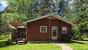 A small, single-story cabin with a porch, a door, and a window. - A Perfect Northern Get-Away On The Scenic Big Creek In Luzerne (Luzerne)