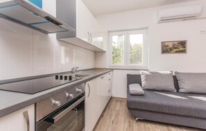 Fridge, stovetop, dishwasher, coffee/tea maker