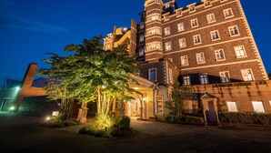 A large, multi-story building with a prominent tower and multiple windows. - Wellness Forest NASU (Nasu)