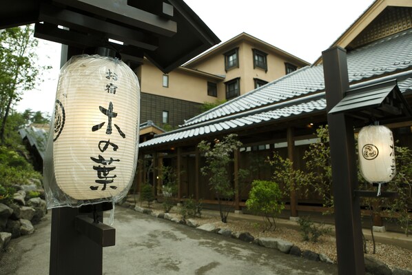 Traditional Japanese architecture surrounded by serene gardens.