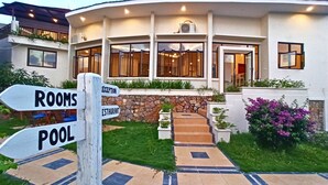 A building with a reception area, rooms, and a pool. - The Happinezz Hills Hotel Karimunjawa (Karimun Jawa)