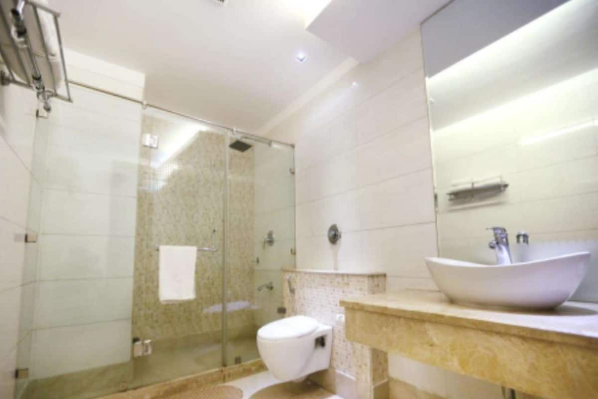 Chambre Deluxe, 2 lits une place | Coffres-forts dans les chambres, rideaux occultants