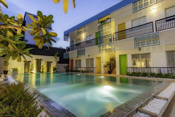 Outdoor pool, open 8:00 AM to 10:30 AM, pool umbrellas, pool loungers