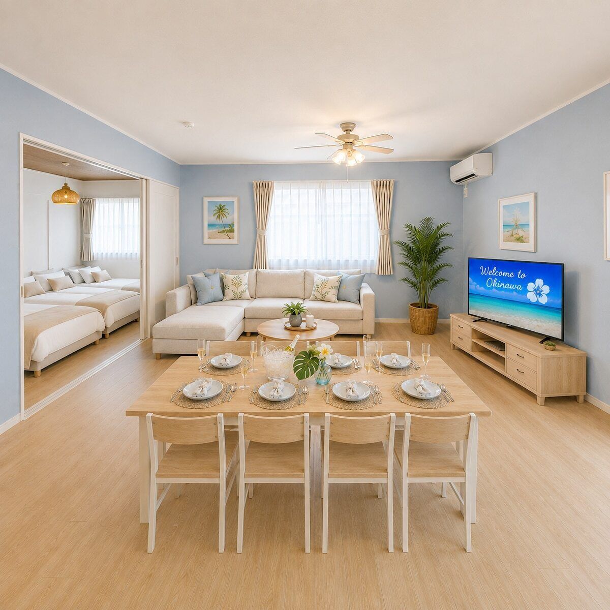Uma sala moderna com um conjunto de sofás, uma mesa de jantar posta para seis pessoas, uma televisão e um ventilador de teto.
