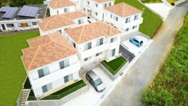 A residential building with multiple units, each with a sloped roof and a carport. - Grandioso Okinawa Villa Onna 2 (Onna)