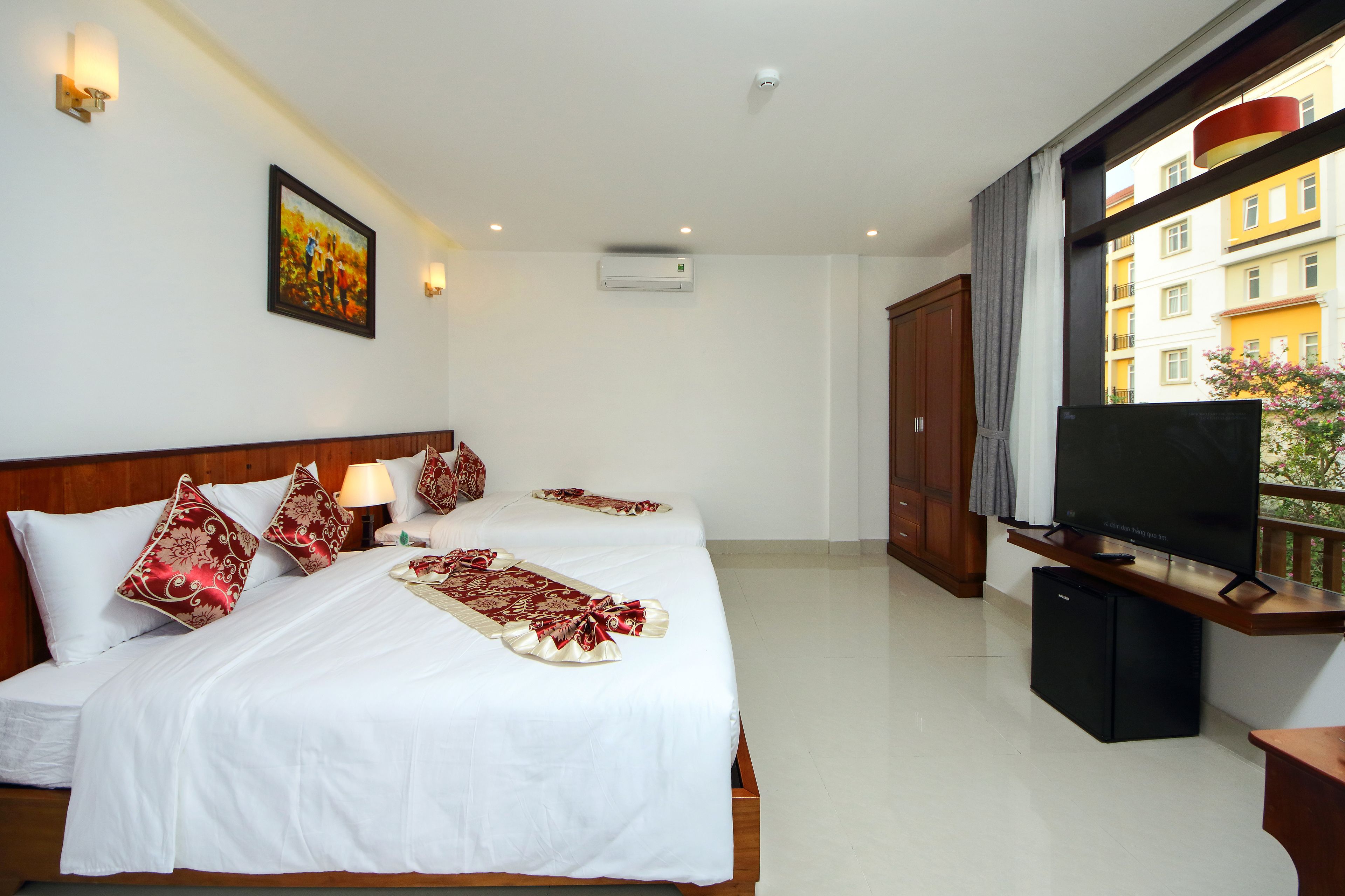 deluxe family room | minibar, in-room safe, desk, blackout curtains