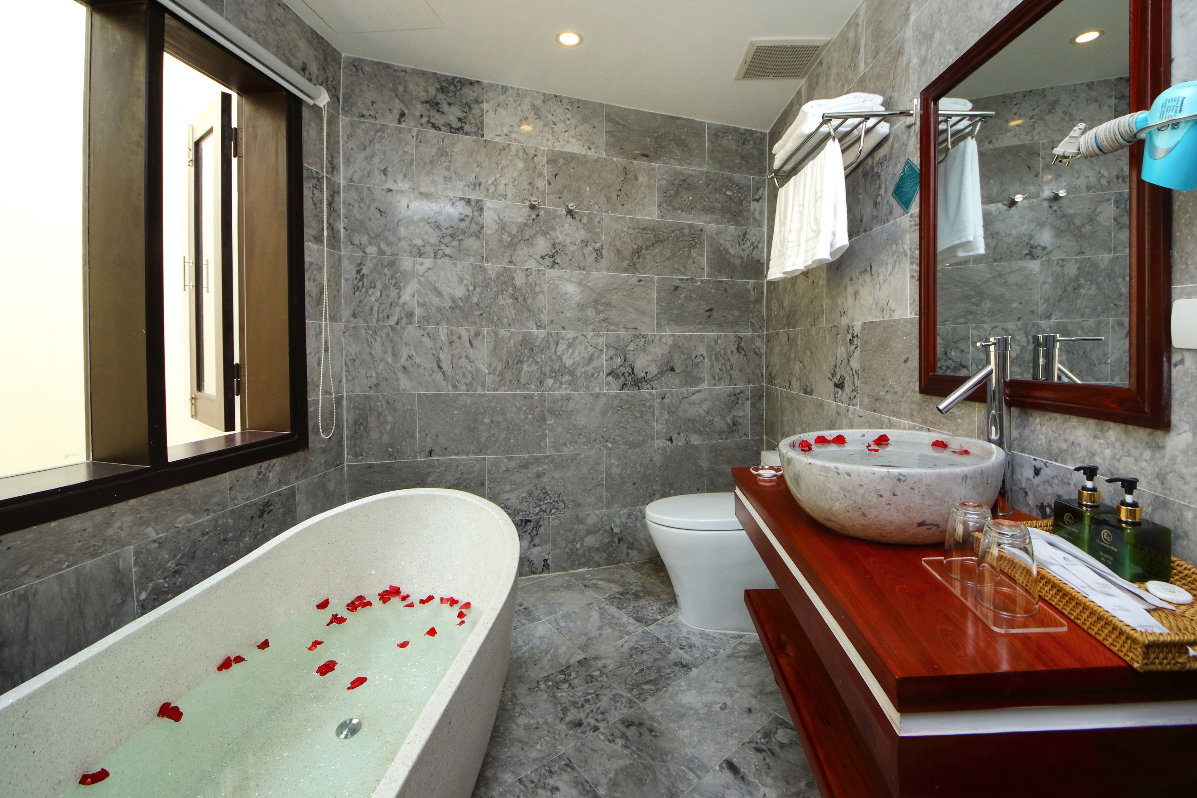 superior family room | bathroom | shower, free toiletries, hair dryer, slippers