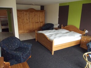 Quadruple Room, Garden View | Living area | Flat-screen TV, foosball