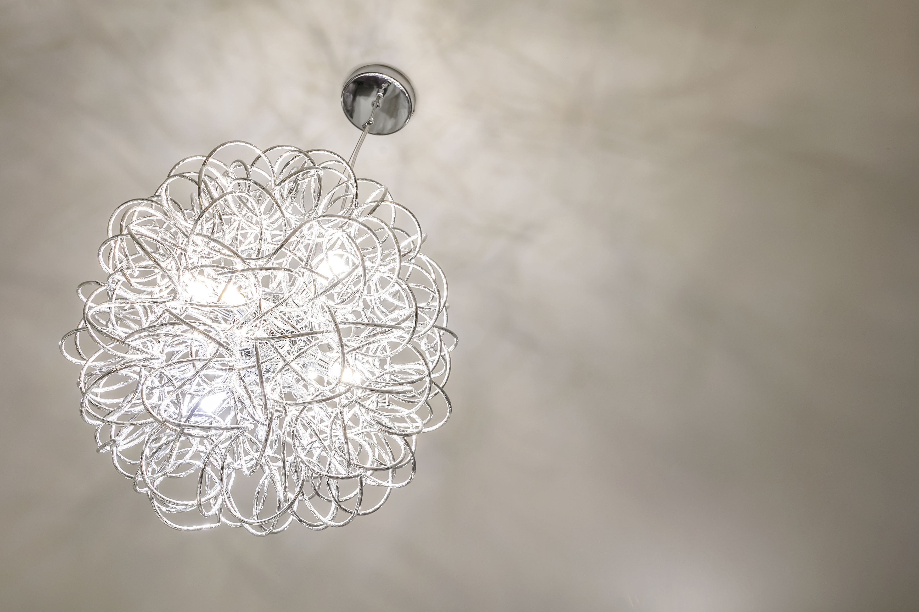 A chandelier with a complex, intertwined design.