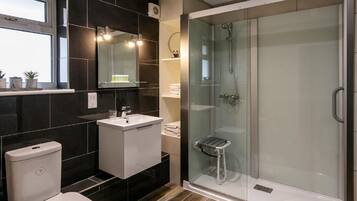 Deluxe Triple Room, Multiple Beds | Bathroom | Rainfall showerhead, free toiletries, hair dryer, towels