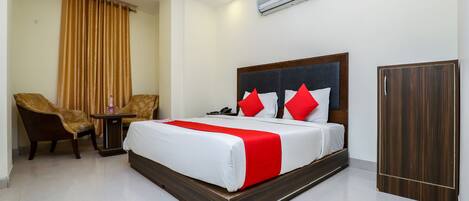 Laptop workspace, bed sheets