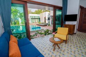 Deluxe Apartment, Pool View (including Free Pick Up) | Living area | 32-inch LCD TV with premium TV channels, TV - Draco Residence (Siem Reap)