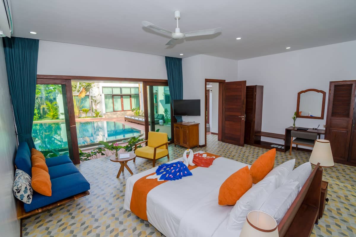 Deluxe Apartment, Pool View (including Free Pick Up) | Minibar, in-room safe, blackout drapes, iron/ironing board