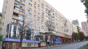 A multi-story hotel with a modern facade, large windows, and a visible restaurant named "PASTIRALLA" on the ground floor.