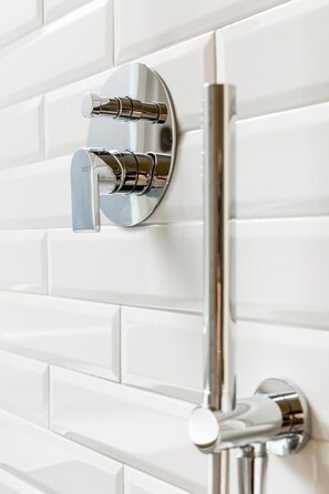 Shower, rainfall showerhead, designer toiletries, hair dryer