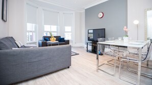 Comfort Apartment, 2 Bedrooms, City View | Living area | Flat-screen TV