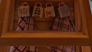 A wooden shelf with a sign that says "Take me to the river" and four mugs with different designs. - Riverland (Duga Resa)