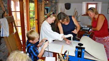 Experience a creative retreat with a table for artistic pursuits and a door leading to the outdoors.
