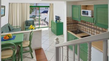 Dúplex, varias camas, balcón | Cocina privada