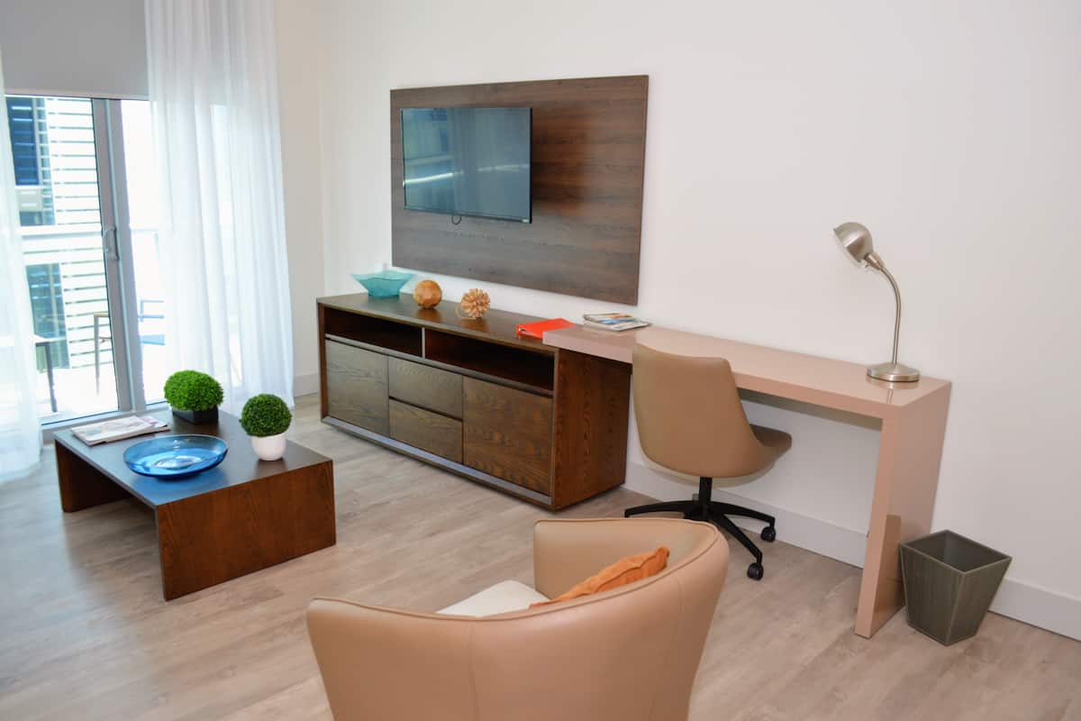 Exclusive Suite, 1 Bedroom, Partial Sea View | Living area | 31-inch flat-screen TV with cable channels, TV, Netflix