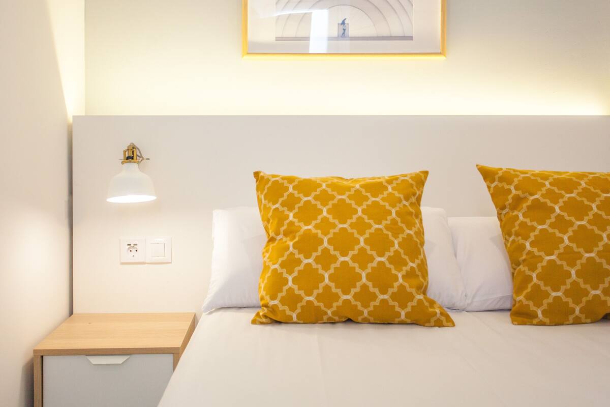 Premium bedding, down comforters, memory foam beds, desk