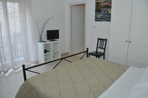 Desk, blackout drapes, soundproofing, iron/ironing board