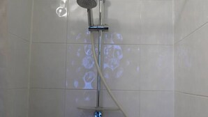 A shower with a handheld showerhead and a wall-mounted control panel. - Beautiful bright room (Le Mesnil-Esnard)