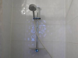 Shower, hair dryer, towels, toilet paper