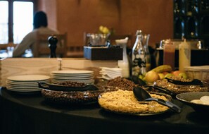 A buffet table with various food items and dishes. - Hotel Horní Dvůr (Nové Mesto na Morave)
