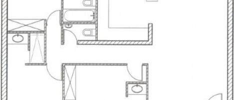 A floor plan with a kitchen, two bathrooms, and a dining area.