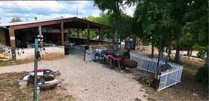Enjoy al fresco dining and relaxation in this serene outdoor patio area with a barbecue grill and seating.
