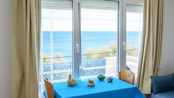 Superior Apartment, Sea View | Living area | Flat-screen TV