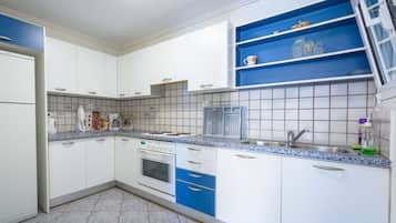 Family Apartment, Beach View | Private kitchen | Full-size fridge, oven, stovetop, electric kettle